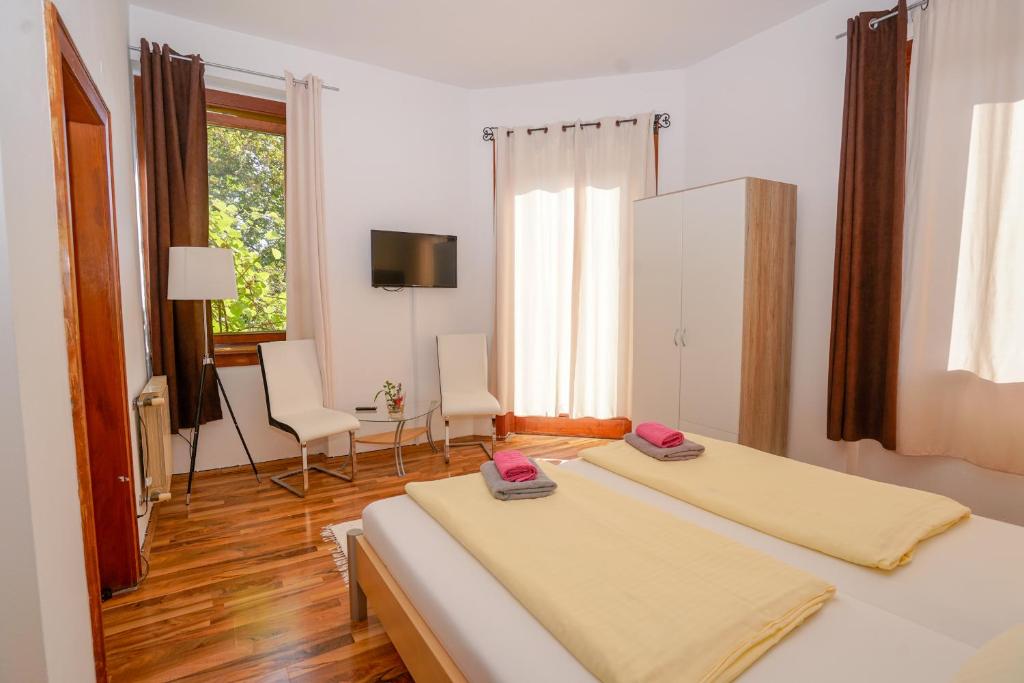 Postel nebo postele na pokoji v ubytování Hotel Rosmann