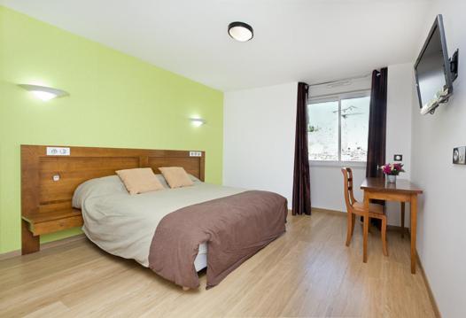 Postel nebo postele na pokoji v ubytování Hotel Etchoinia