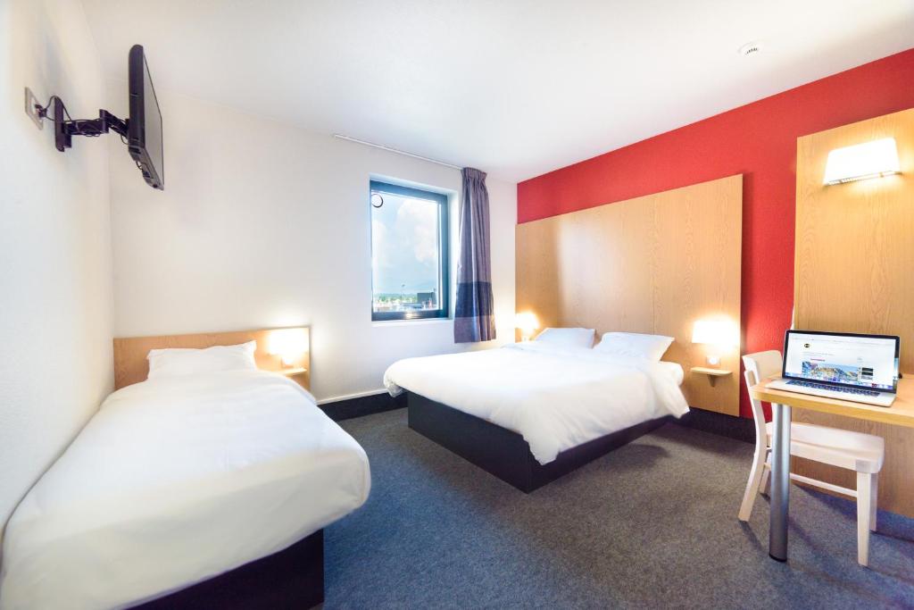 Postel nebo postele na pokoji v ubytování B&B HOTEL Colmar Expo
