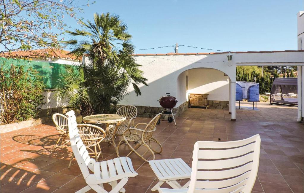 A patio or other outdoor area at Stunning Home In Miami-Platja With Wifi