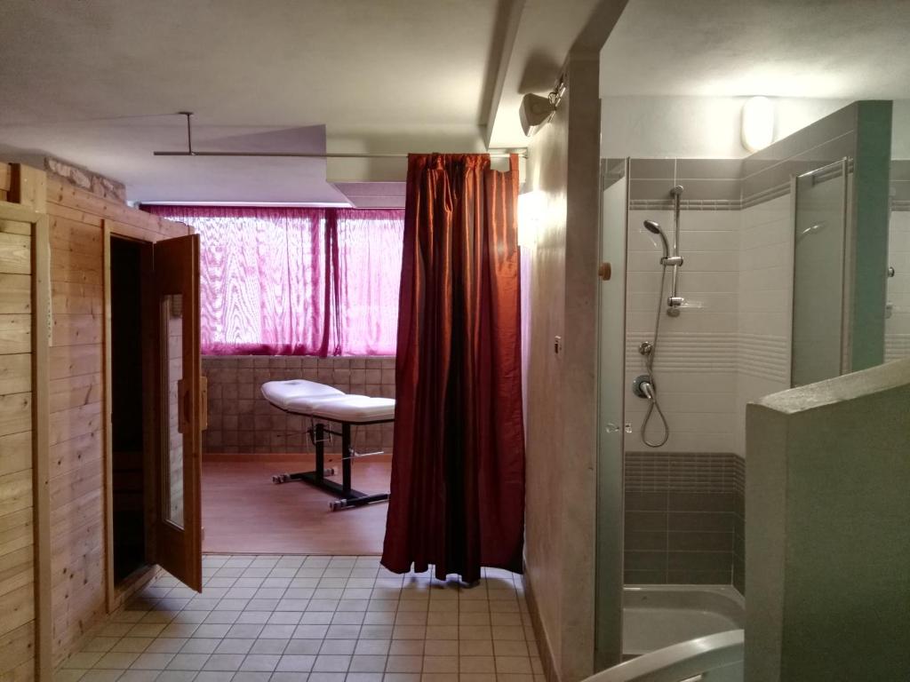 A bed or beds in a room at Hotel Residence Sanremo
