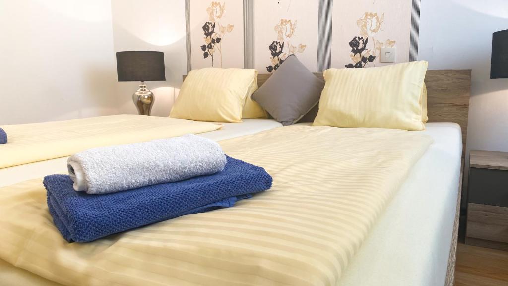 Postel nebo postele na pokoji v ubytování Hotel Rosmann