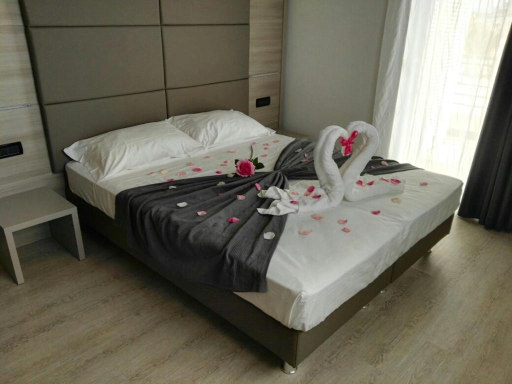 A bed or beds in a room at Hotel Residence Sanremo