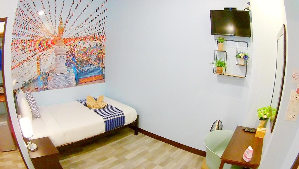 Postel nebo postele na pokoji v ubytování Mango House