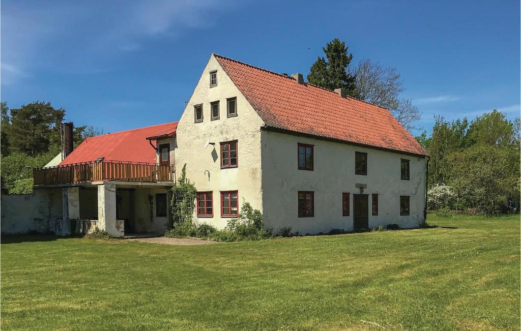 a large white house with a red roof at Awesome Apartment In Havdhem With 3 Bedrooms And Wifi in Havdhem