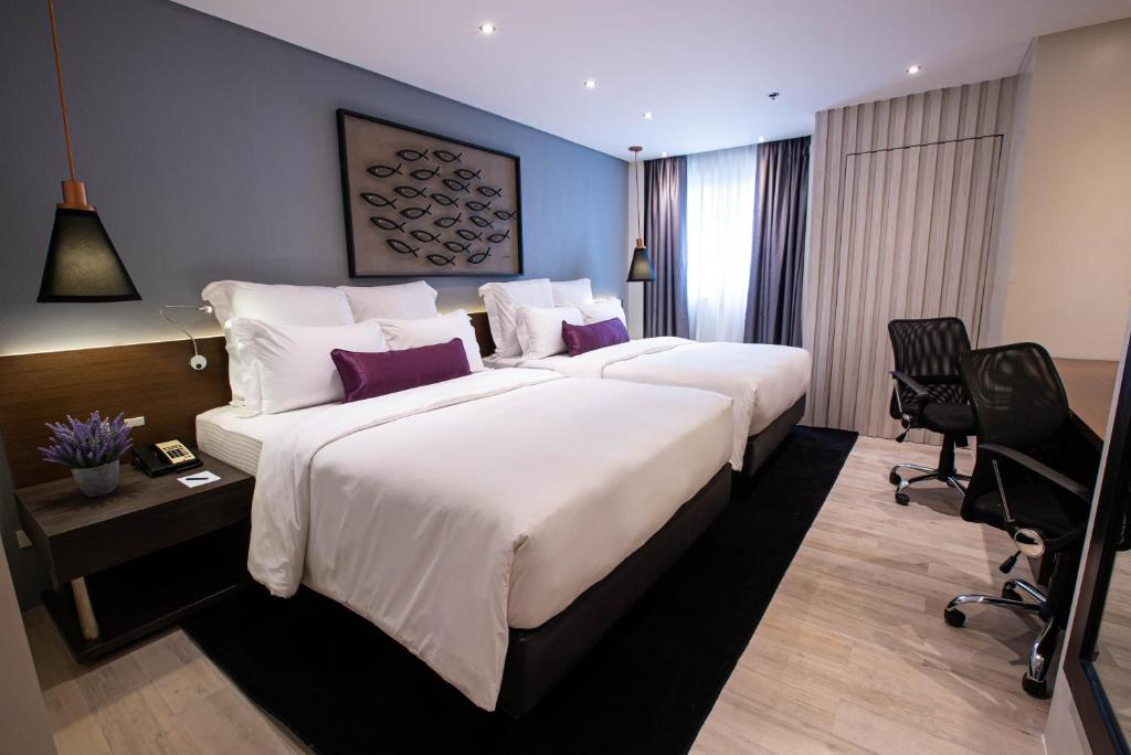 Postel nebo postele na pokoji v ubytování Coro Hotel
