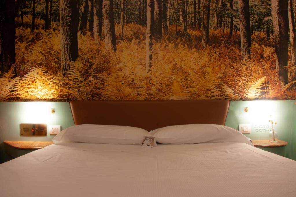Postel nebo postele na pokoji v ubytování Hotel Motel 2000