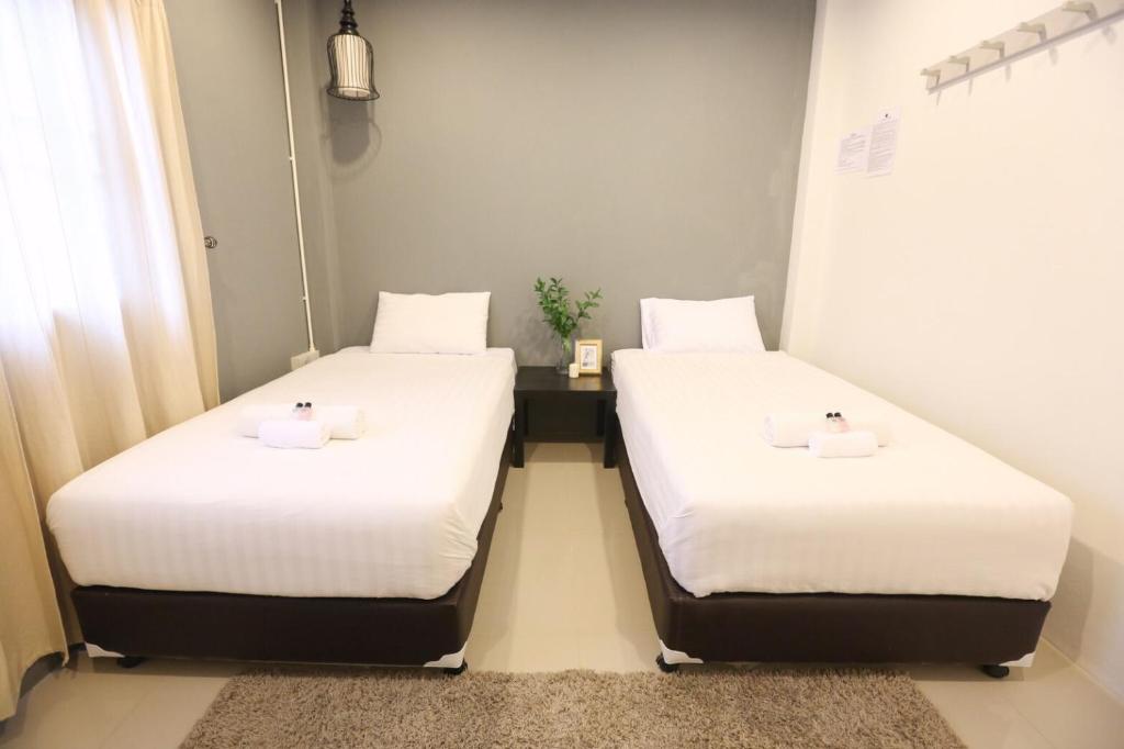 Postel nebo postele na pokoji v ubytování First Residence