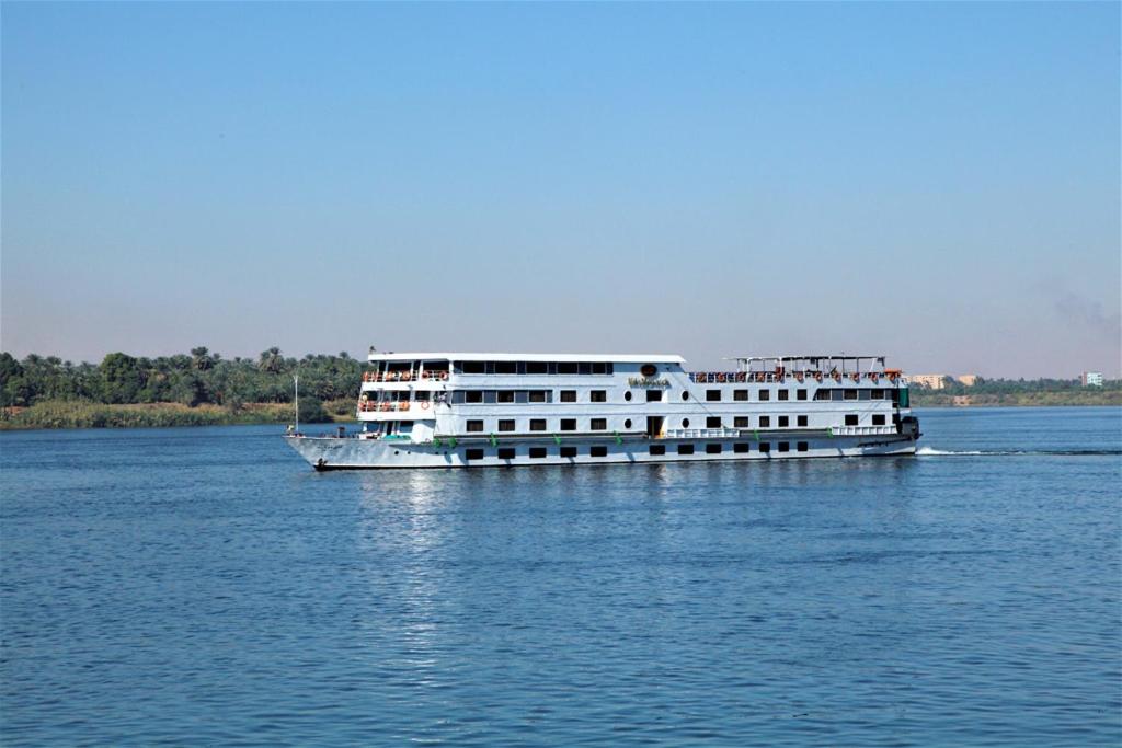 a large white boat on the water at Jaz Monarch Nile Cruise - Every Monday from Luxor for 07 & 04 Nights - Every Friday From Aswan for 03 Nights in Luxor