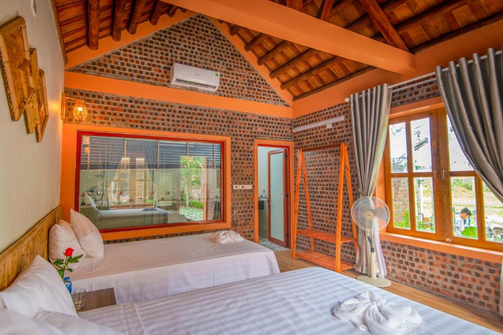 Postel nebo postele na pokoji v ubytování Tam Coc Summer Bungalow