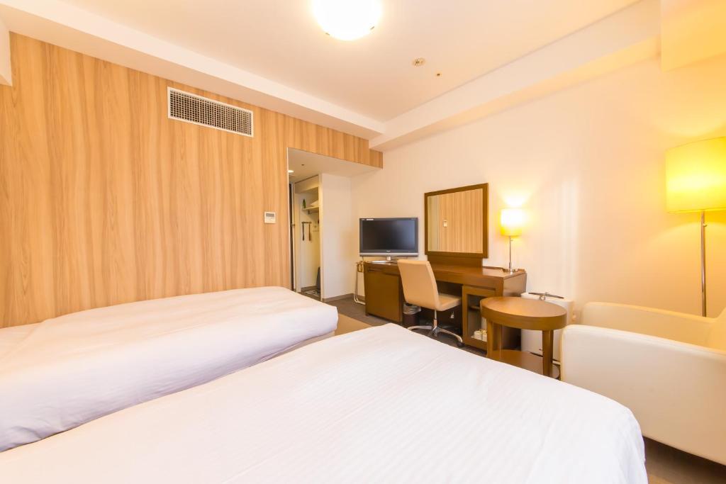 Postel nebo postele na pokoji v ubytování Hotel IL Cuore Namba