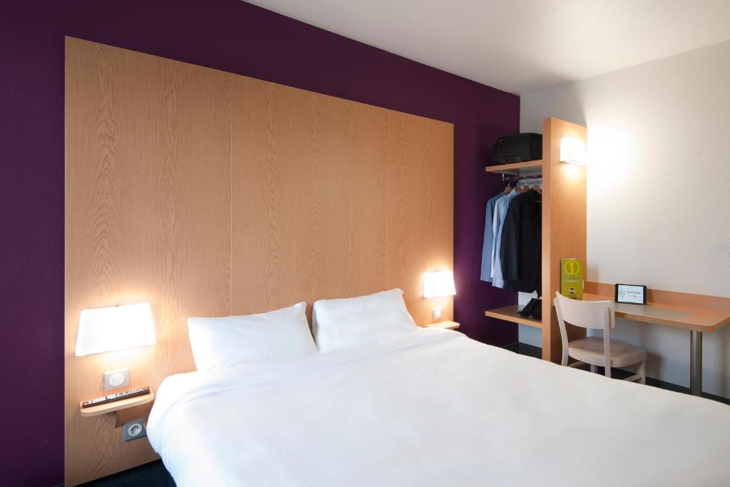 Postel nebo postele na pokoji v ubytování B&B HOTEL Lyon Eurexpo Chassieu