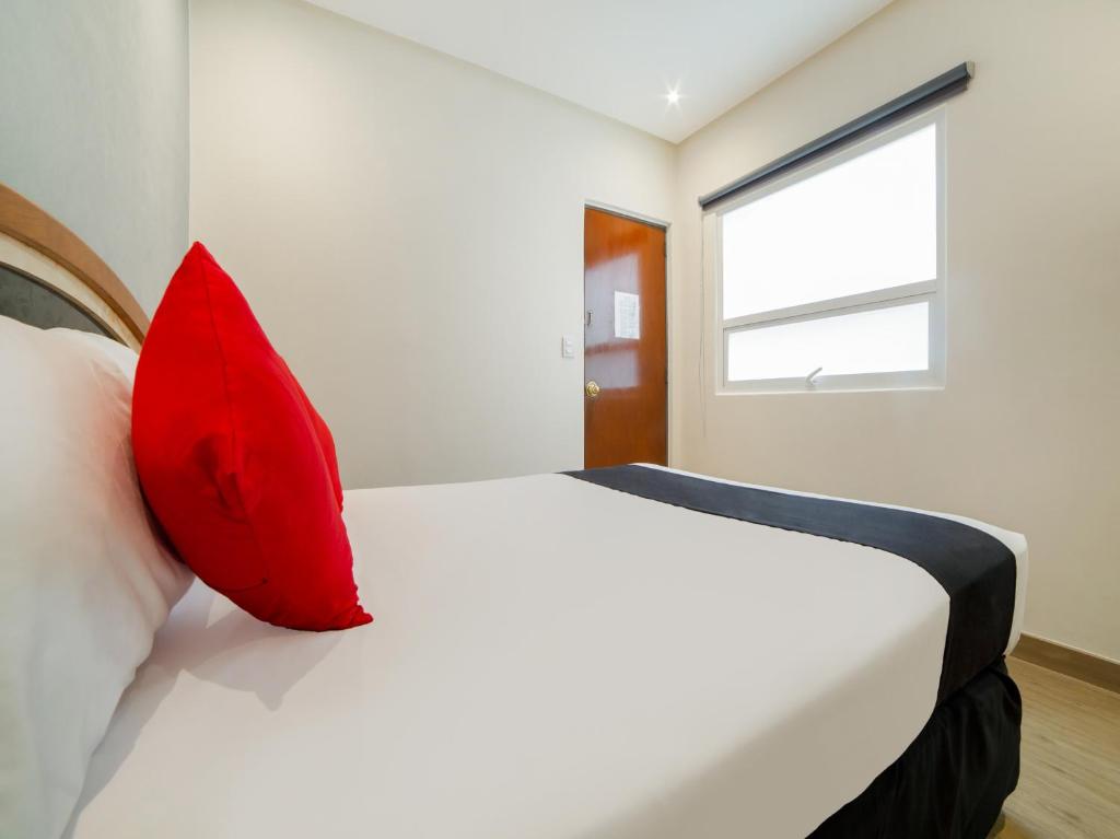 Postel nebo postele na pokoji v ubytování Hotel Monarca
