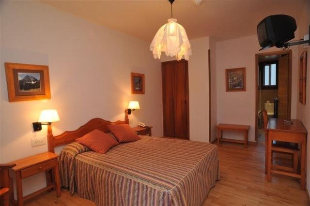 Postel nebo postele na pokoji v ubytování Hotel Roya