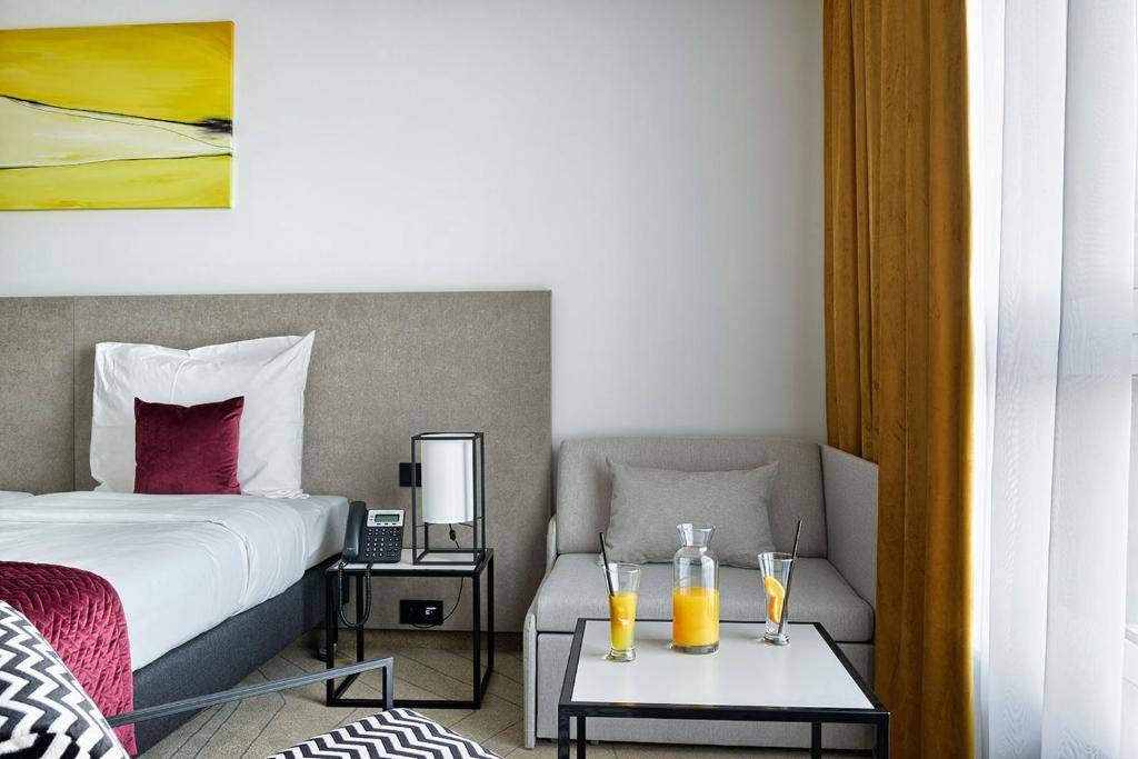 Posteľ alebo postele v izbe v ubytovaní Arche Hotel Krakowska
