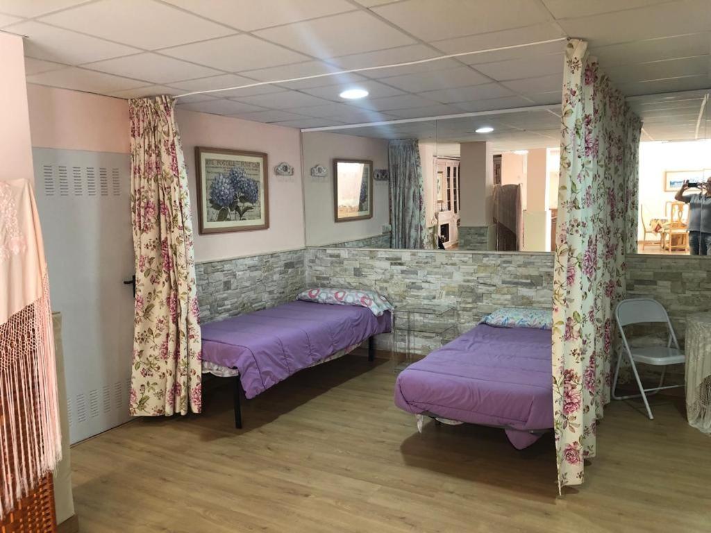 En eller flere senger på et rom på Ideal loft Malaga