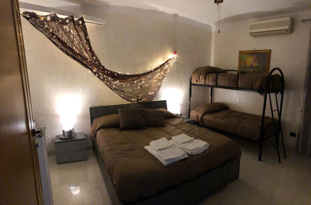 Postel nebo postele na pokoji v ubytování B&B Planet