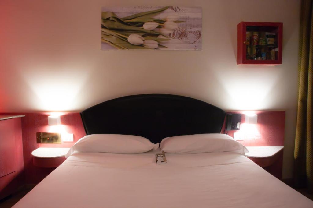 Postel nebo postele na pokoji v ubytování Hotel Motel 2000