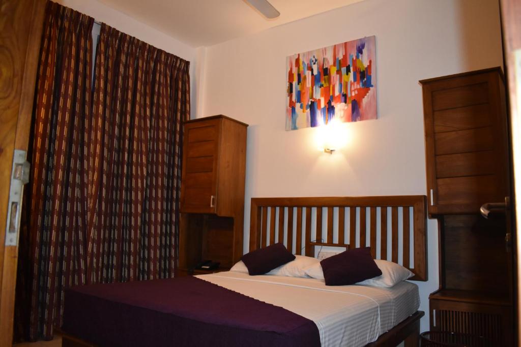 Postel nebo postele na pokoji v ubytování Port View City Hotel