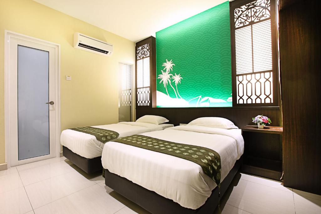 Postel nebo postele na pokoji v ubytování Sri Enstek Hotel KLIA, KLIA 2 & F1