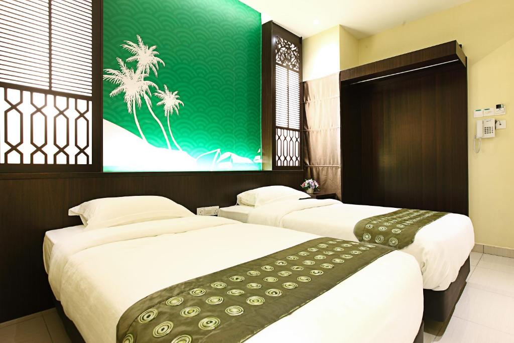 Postel nebo postele na pokoji v ubytování Sri Enstek Hotel KLIA, KLIA 2 & F1