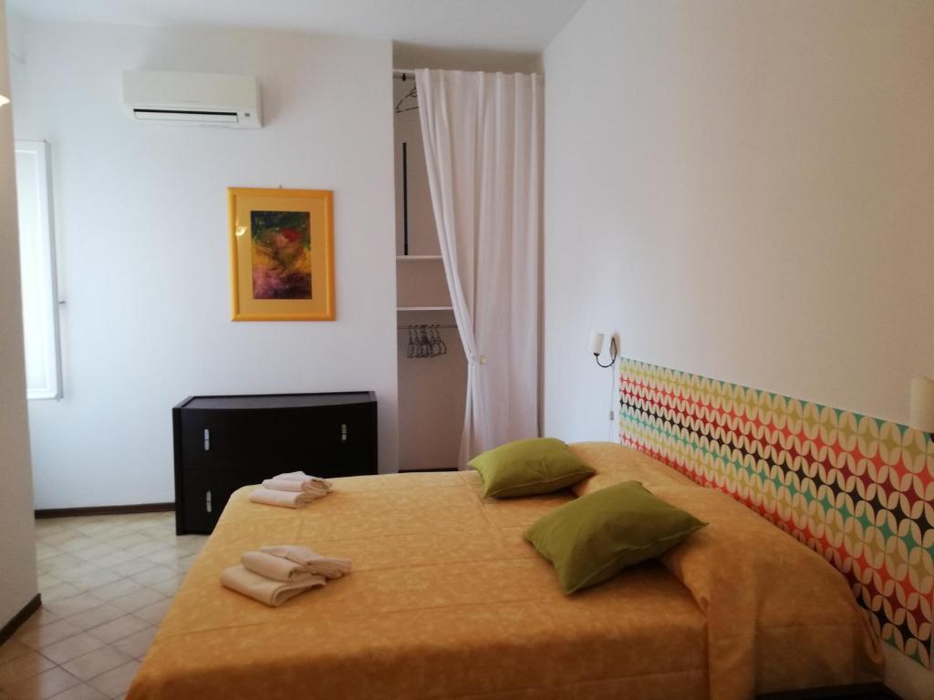 Posteľ alebo postele v izbe v ubytovaní Appartamento Silvana