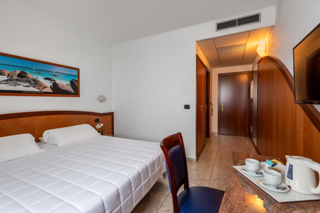 Postel nebo postele na pokoji v ubytování Rivoli Hotel