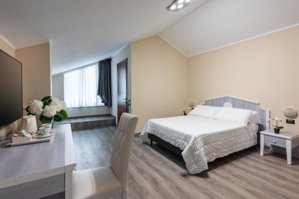 Postel nebo postele na pokoji v ubytování Rivoli Hotel