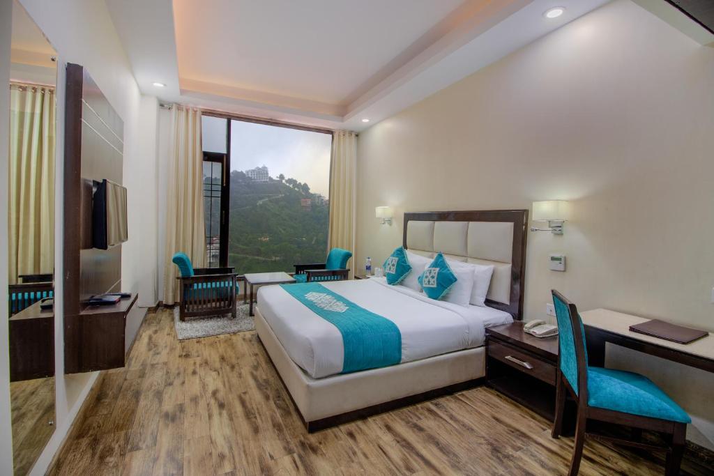 Postel nebo postele na pokoji v ubytování Snow Valley Resorts Shimla