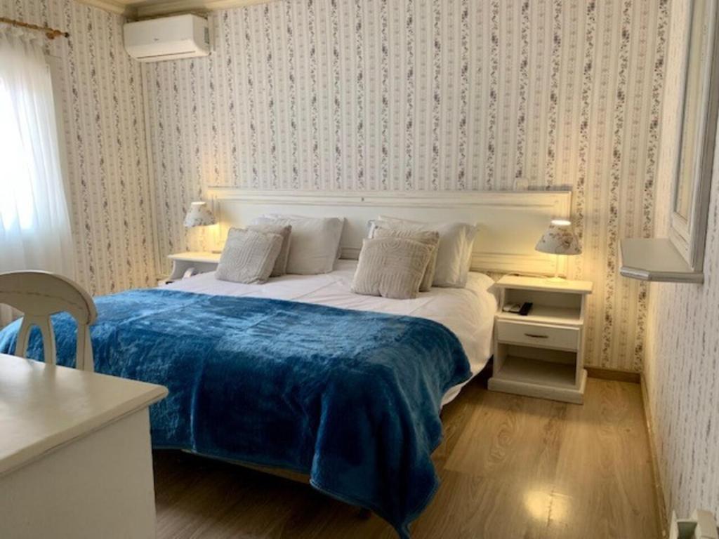 Postelja oz. postelje v sobi nastanitve Petit Hotel Provence Gramado