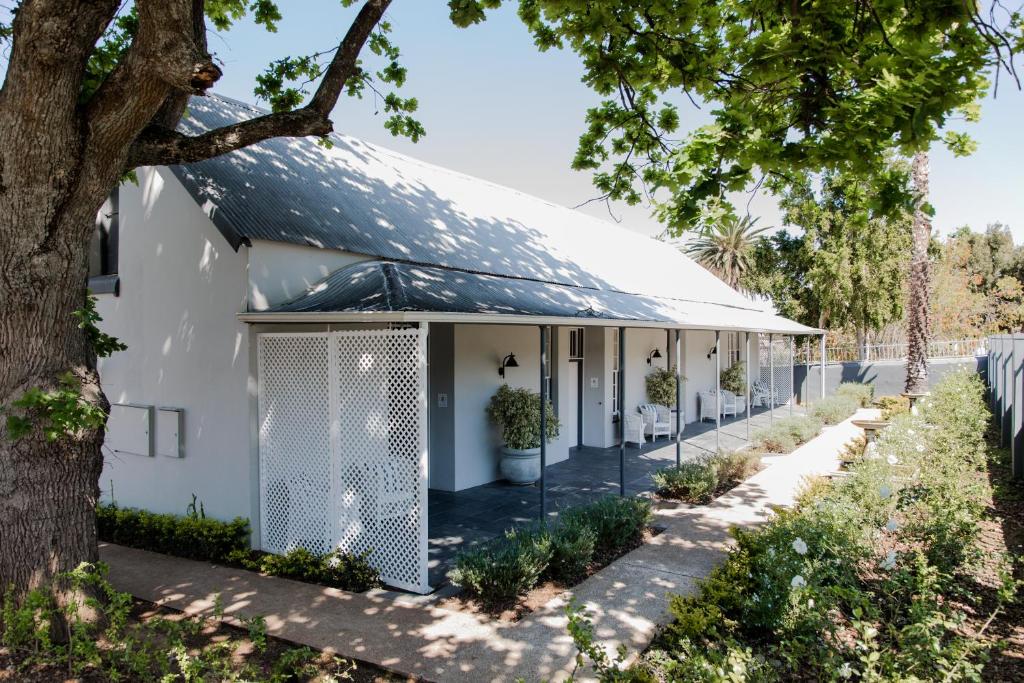 a white house with a metal roof at Elianthe Boutique Guesthouse in Swellendam