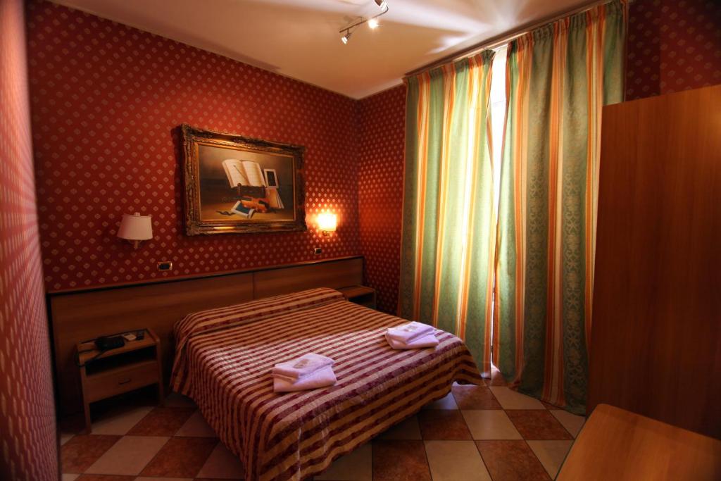 Postel nebo postele na pokoji v ubytování Hotel Hollywood