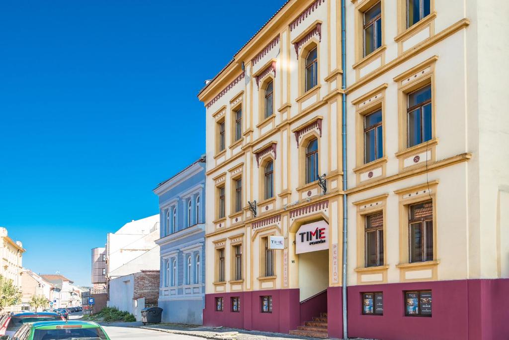 a building on the side of a street at Penzión TIME in Prešov