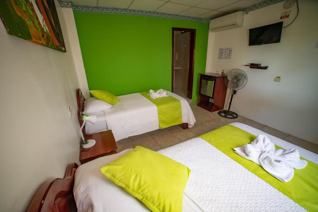 Postel nebo postele na pokoji v ubytování Hostal Gladismar