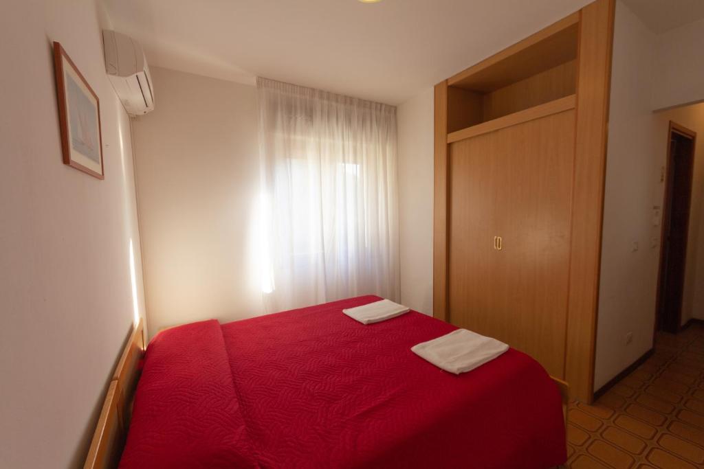 Postel nebo postele na pokoji v ubytování Hotel Calipso