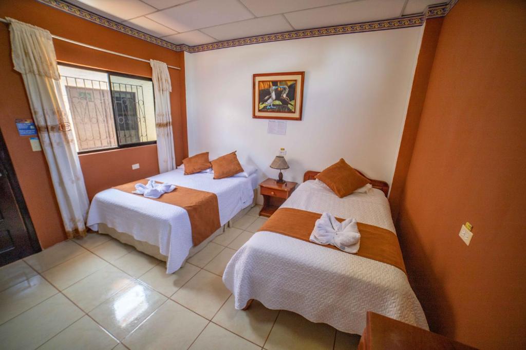 Postel nebo postele na pokoji v ubytování Hostal Gladismar