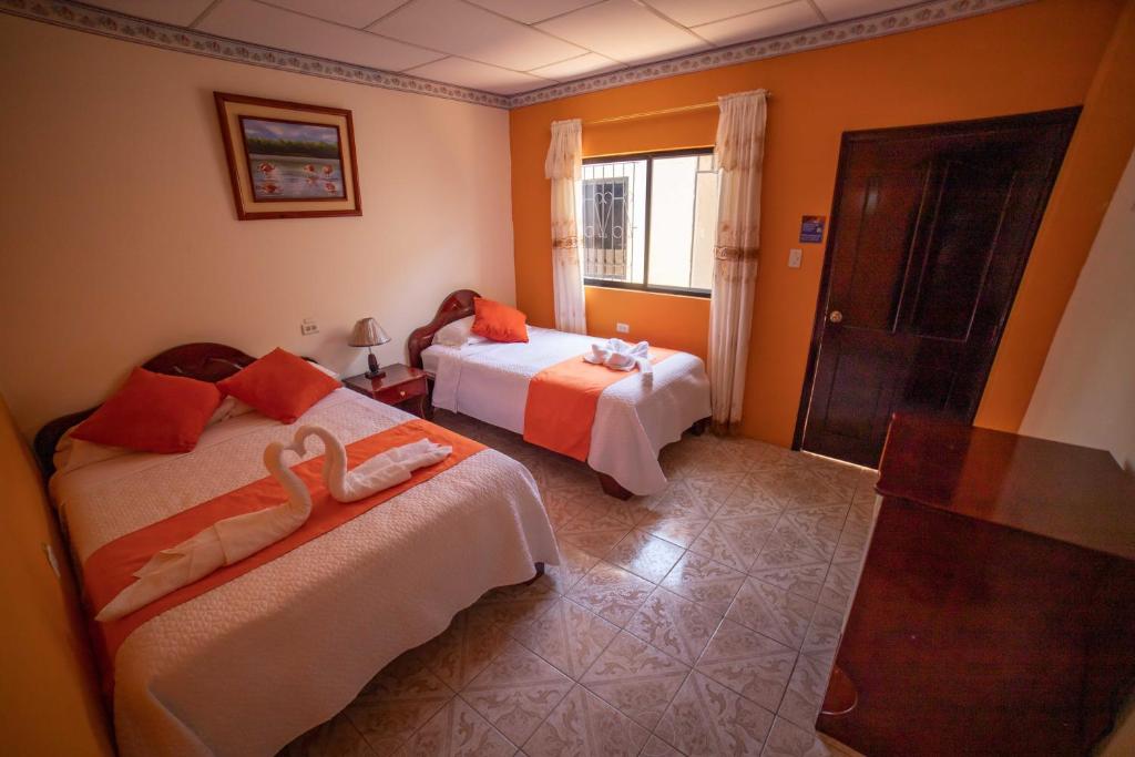 Postel nebo postele na pokoji v ubytování Hostal Gladismar