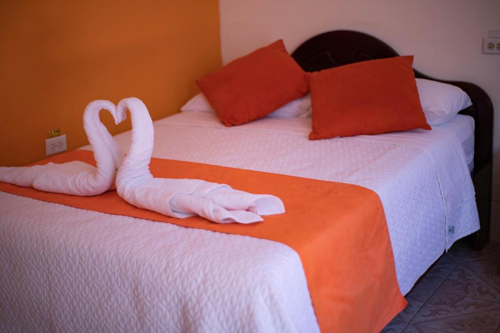 Postel nebo postele na pokoji v ubytování Hostal Gladismar