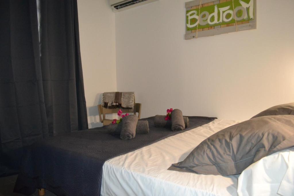 Postel nebo postele na pokoji v ubytování LES VILLAS TARA ET ANAIS