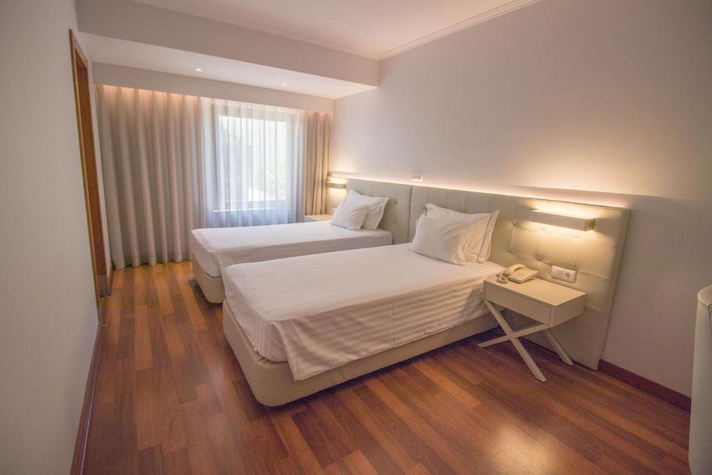 Posteľ alebo postele v izbe v ubytovaní Hotel Travel Park Lisboa