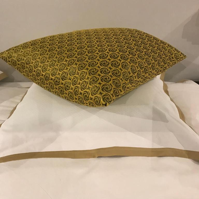 Postel nebo postele na pokoji v ubytování Koto Garden Suites