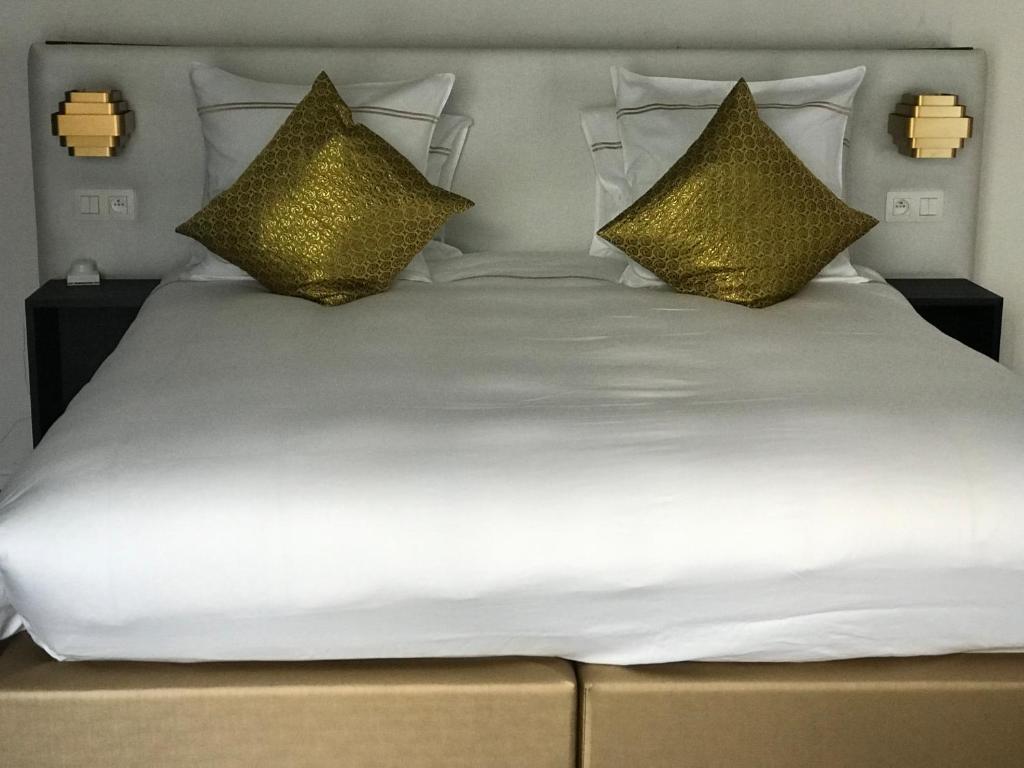 Postel nebo postele na pokoji v ubytování Koto Garden Suites