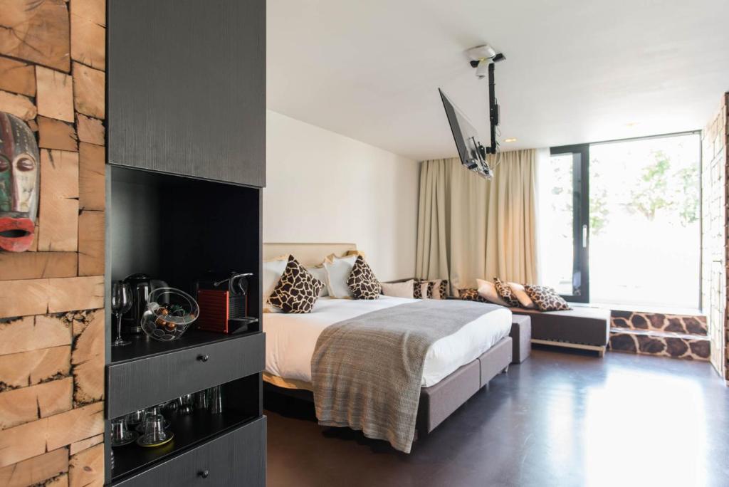 Postel nebo postele na pokoji v ubytování Koto Garden Suites