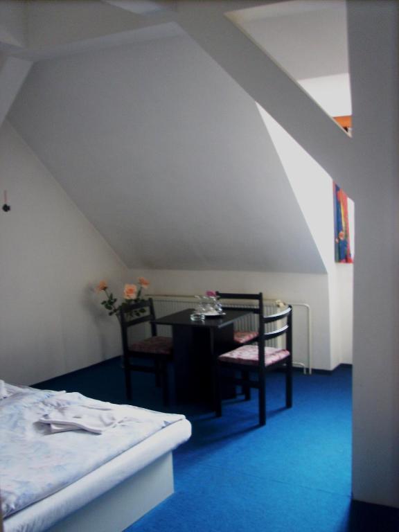 Postel nebo postele na pokoji v ubytování Hotel Parkán
