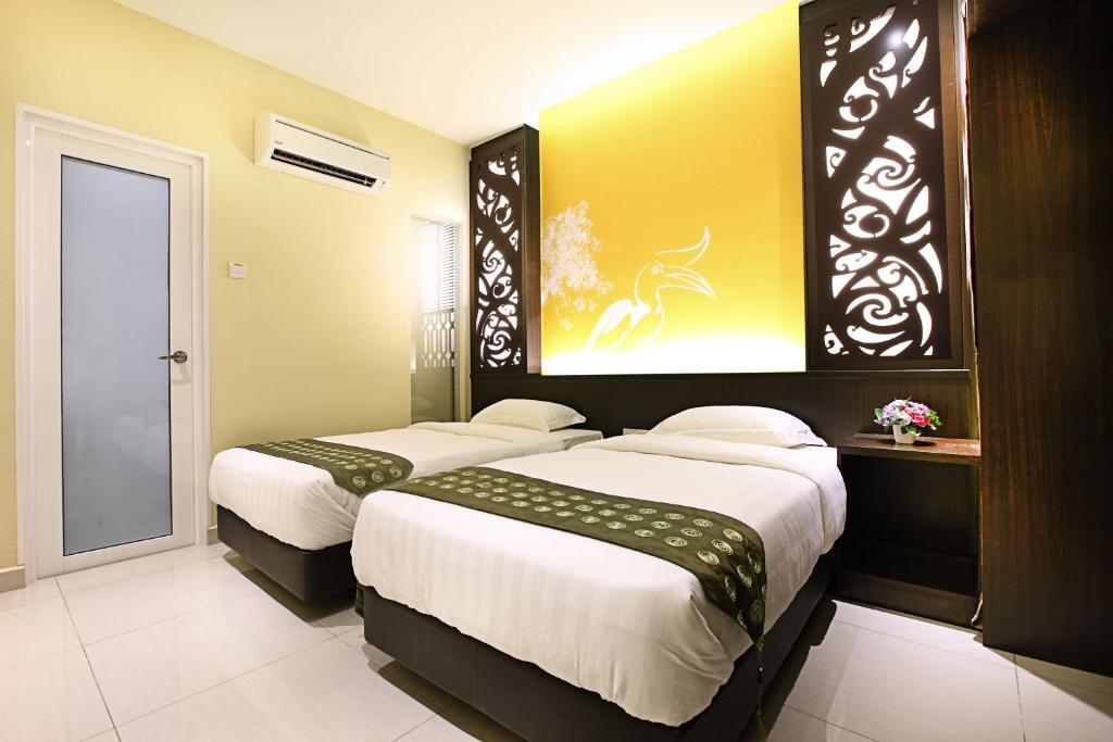 Postel nebo postele na pokoji v ubytování Sri Enstek Hotel KLIA, KLIA 2 & F1
