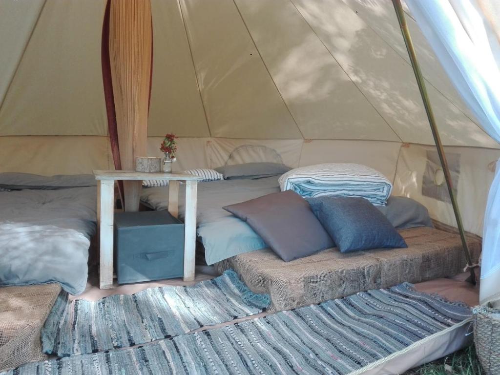 Voodi või voodid majutusasutuse Rifugio Manfre Bivouac Tent toas