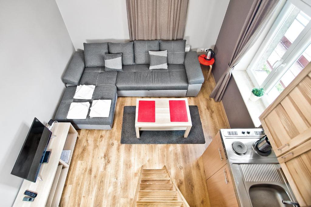 an overhead view of a living room with a couch at Smart Rooms for Rent in Kraków