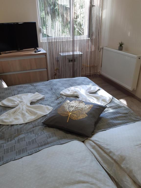 Postel nebo postele na pokoji v ubytování HeNa apartman