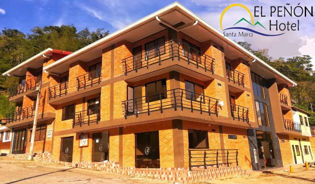 a building with balconies on the side of it at Hotel el peñón in Santa María