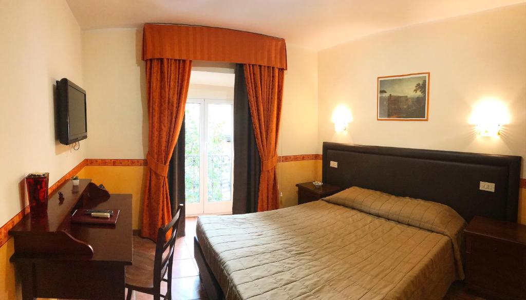 Ένα ή περισσότερα κρεβάτια σε δωμάτιο στο Locanda San Cosimato